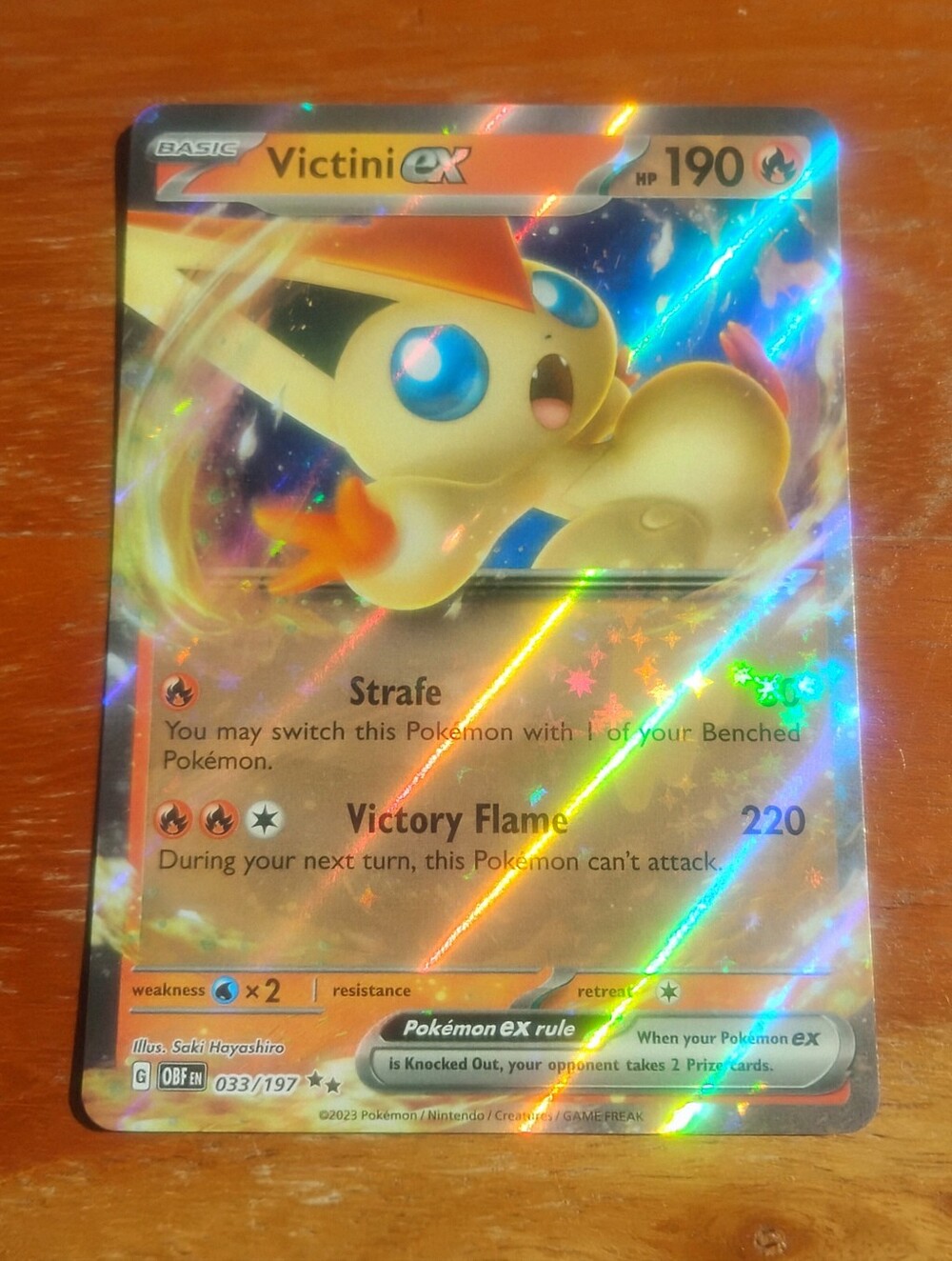 Near Mint 2023 Holo Victini EX 033/197 Obsidian Flames Pokemon Card
